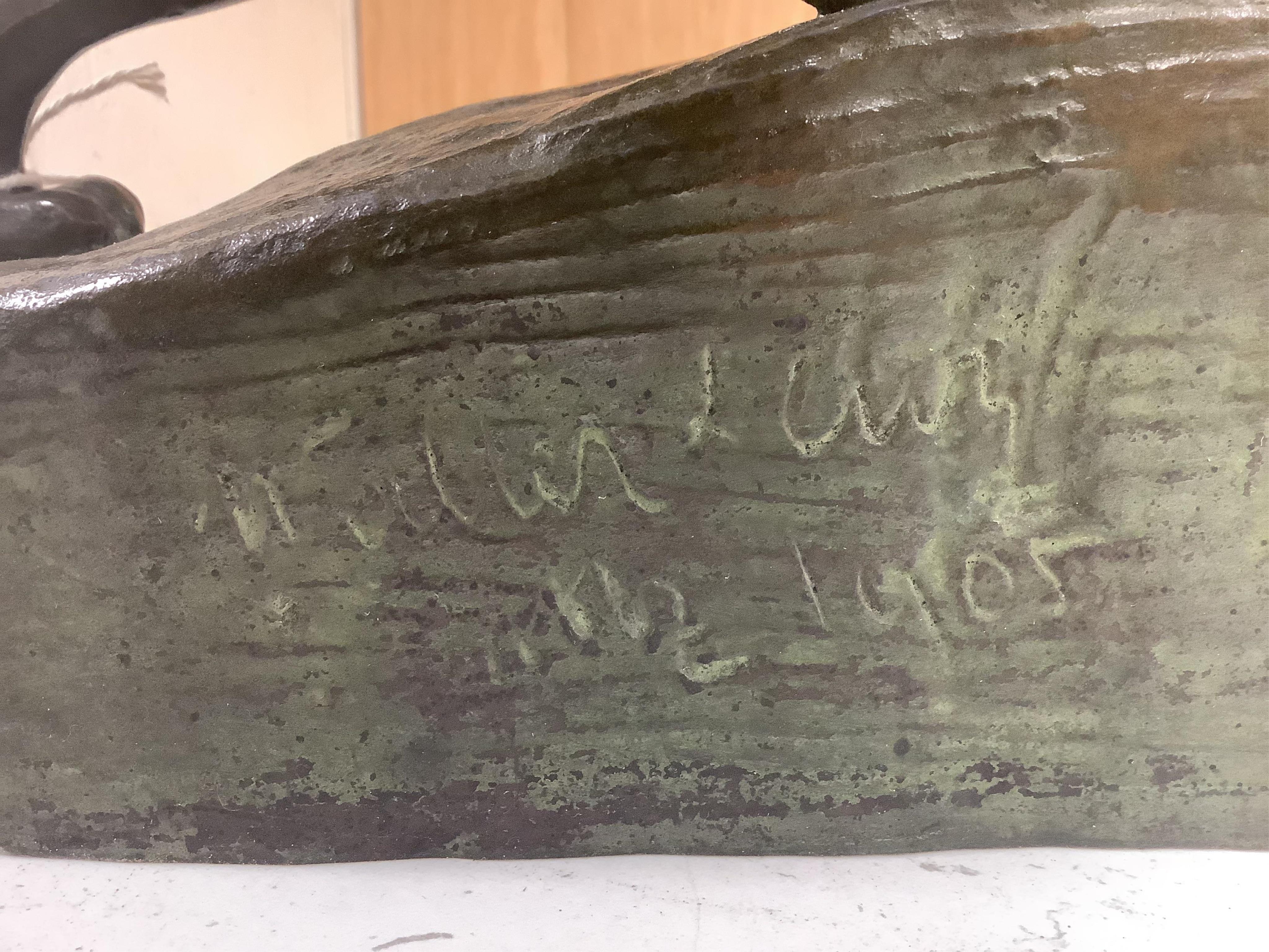 A bronze study of a lion, indistinctly signed and dated 1905, 40cm wide. Condition - good